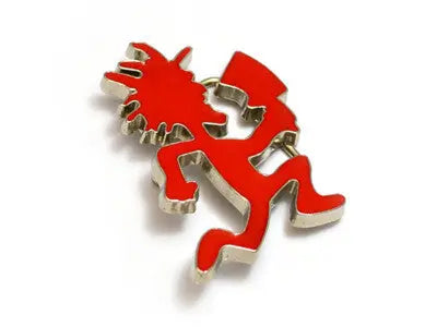 Red Kokopelli figurine belt buckle on a white background