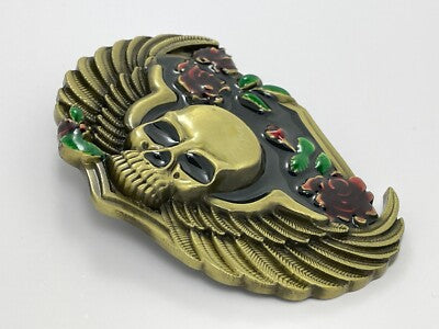 Angle View Decorative belt buckle with skull design and floral elements on a white background