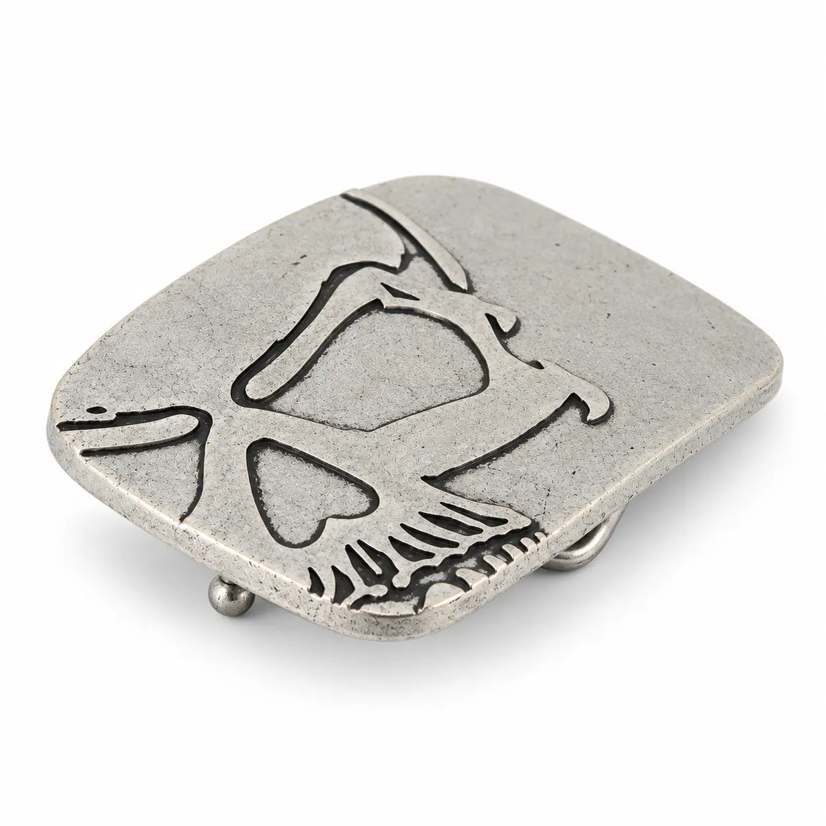 Angled view of silver cutaway skull belt buckle showing raised metal detailing