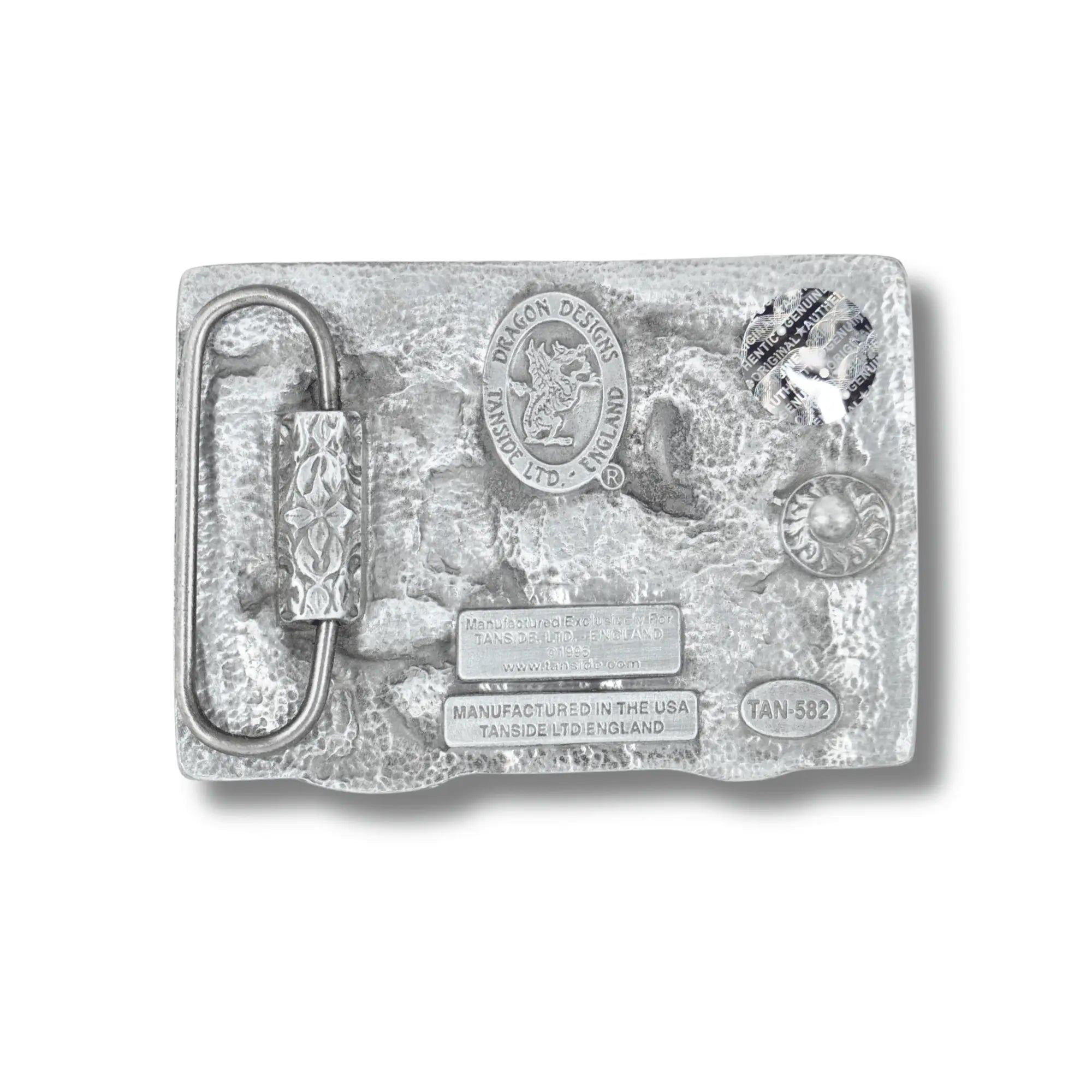 Silver belt buckle with detailed design on a white background