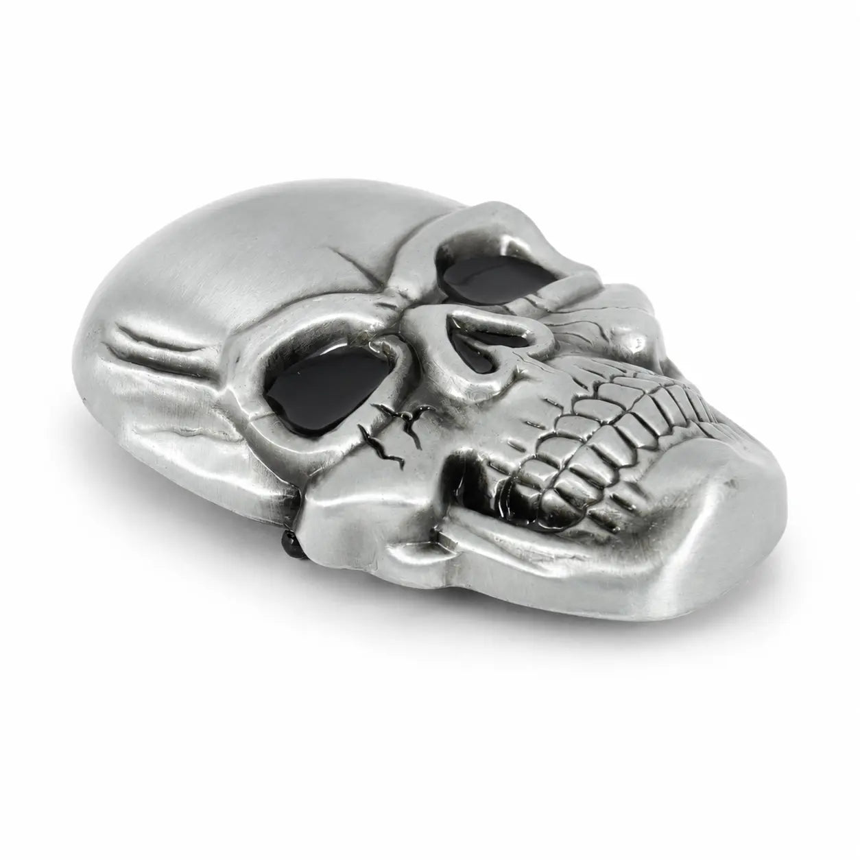 Silver skull belt buckle on a white background
