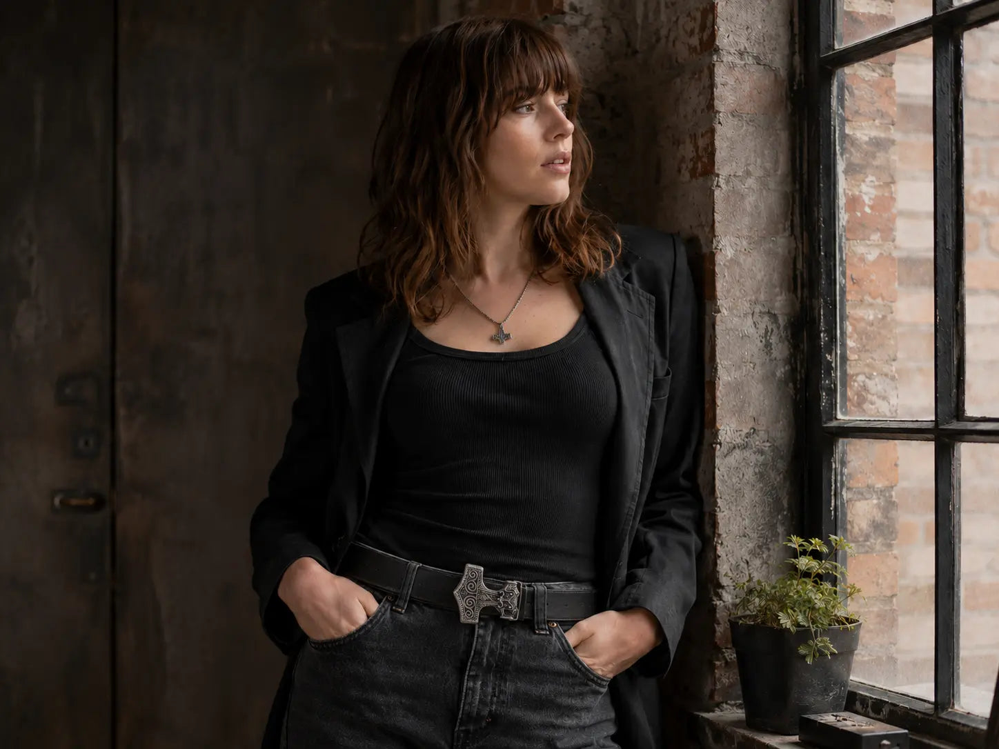 Lady in black wearing anchor belt buckle