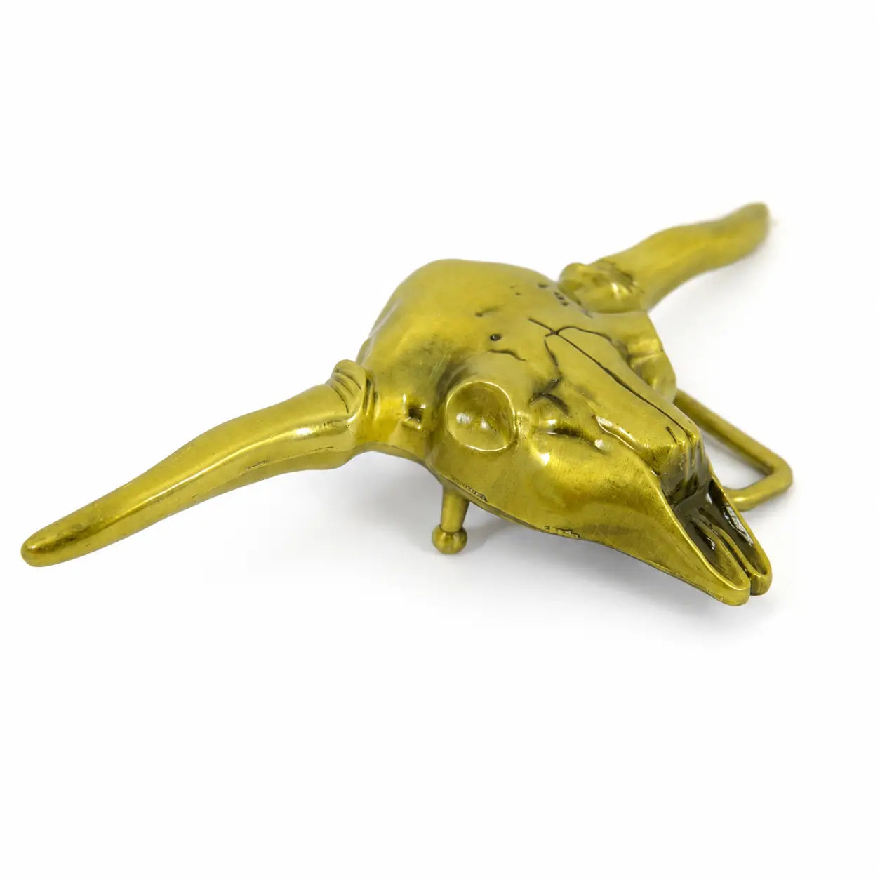 A metallic gold loghorn skull belt buckle with long horns, displayed on a clean white background.