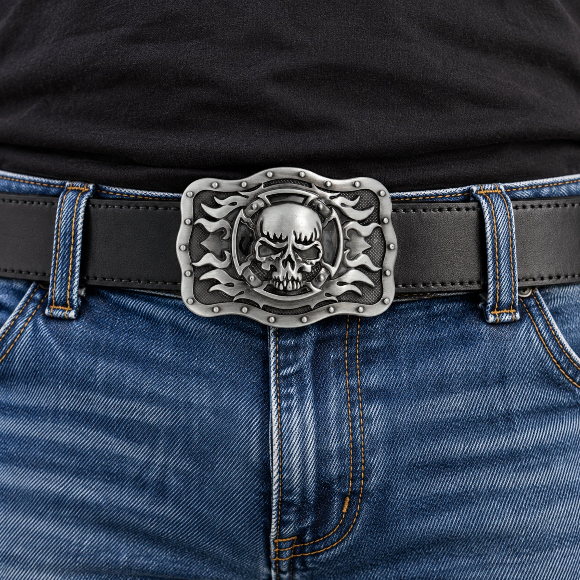 Grey skull and flames belt buckle worn on a black leather belt