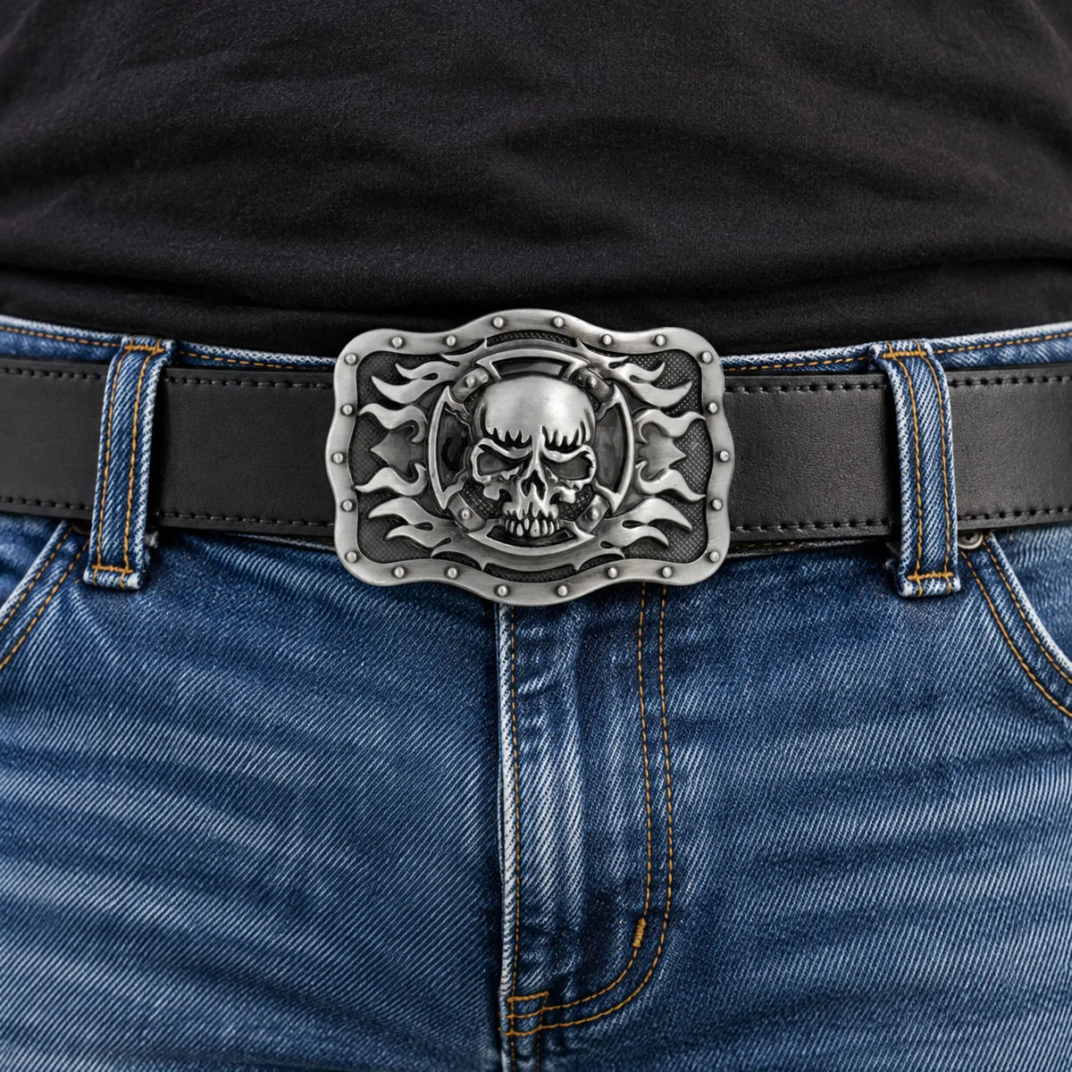 Grey skull and flames belt buckle worn on a black leather belt