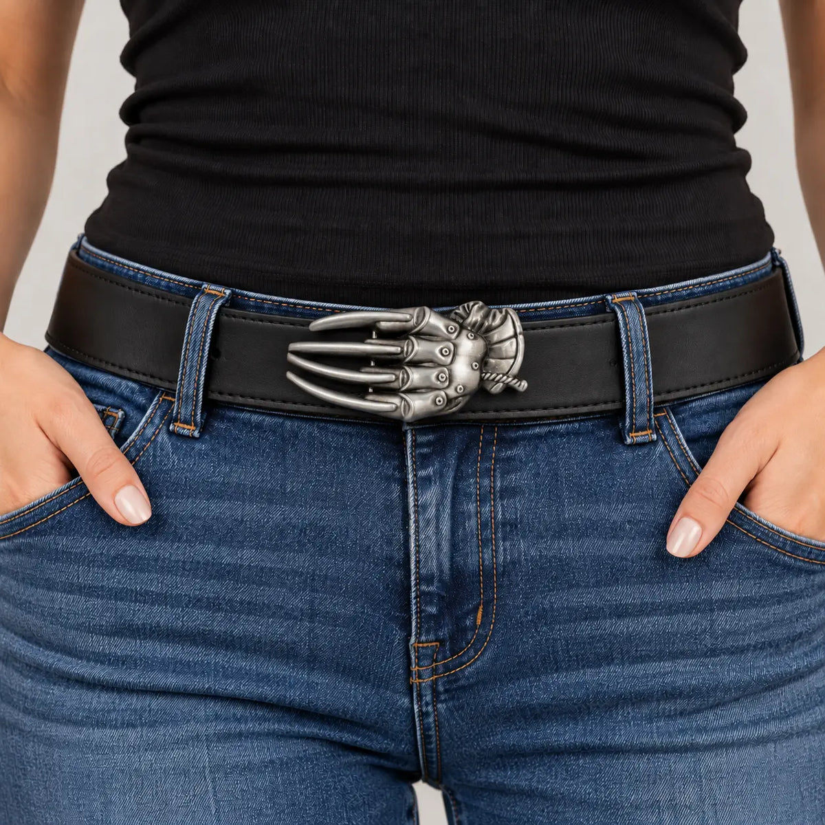 Razor glove belt buckle worn on a black leather belt