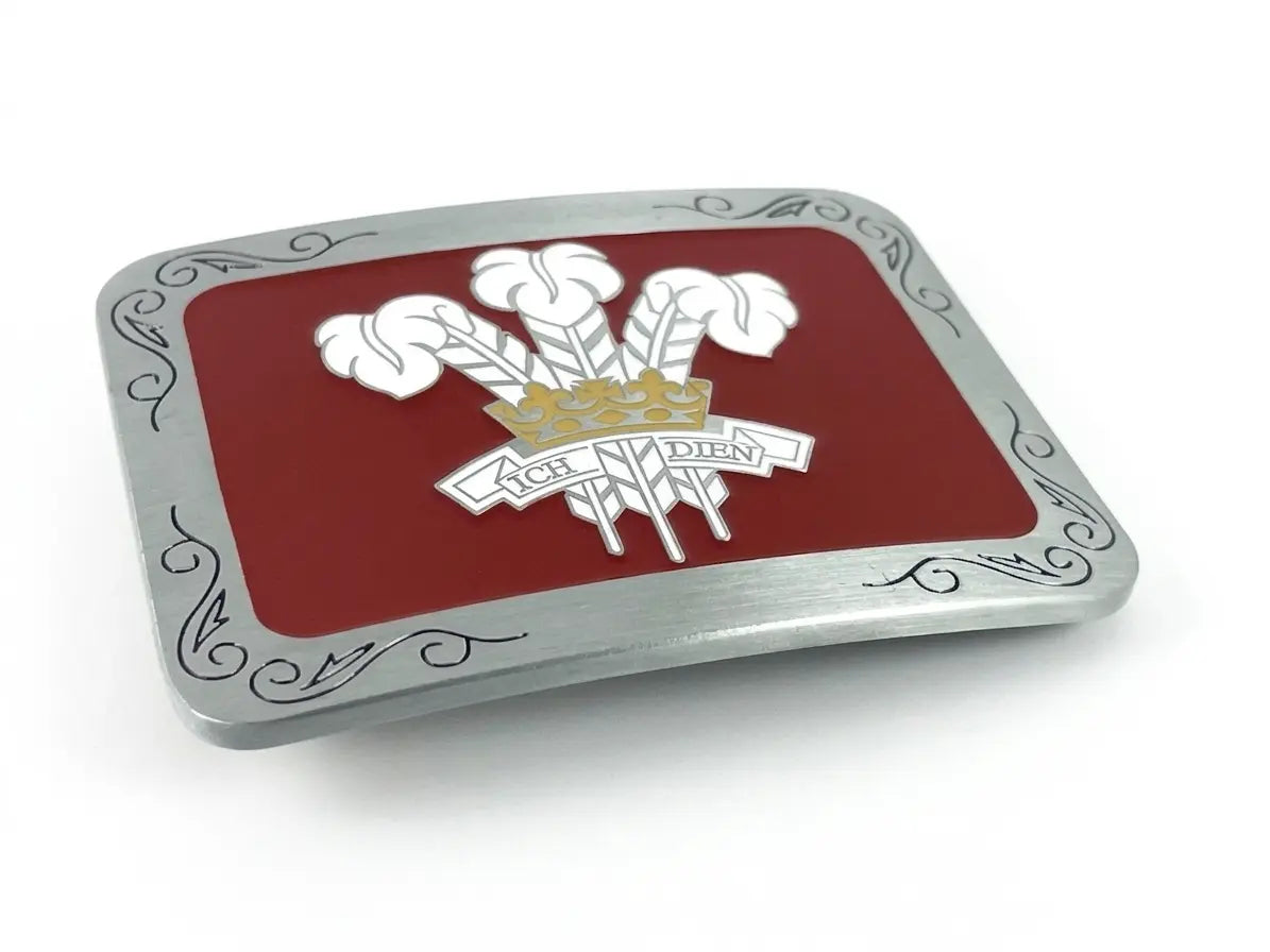 Welsh belt buckle with white prince of wales feathers on a red enamel background.