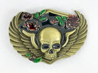 Decorative belt buckle with skull design and floral elements on a white background