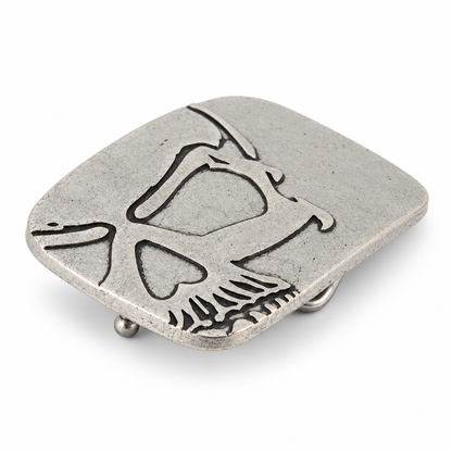 Angled view of silver cutaway skull belt buckle showing raised metal detailing