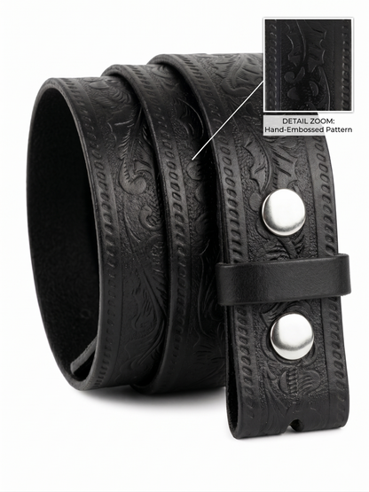Black leather belt with hand-embossed pattern and silver buckle on a white background