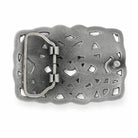 Rear of a rectangular silver-toned metal belt buckle with an ornate scalloped border and cutout geometric pattern, shown on a plain white background.