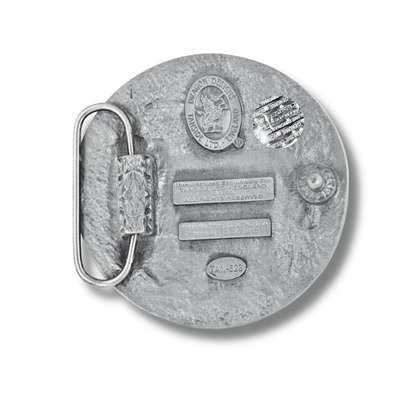 Silver belt buckle with engraved details on a white background