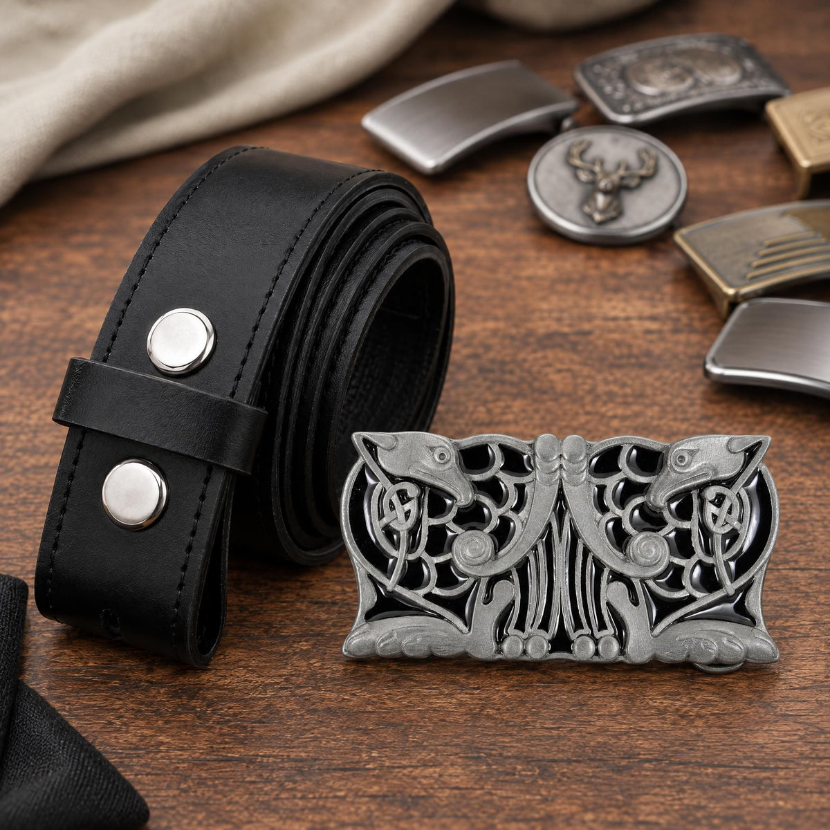 Flat lay of the black Celtic Birds Design metal belt buckle