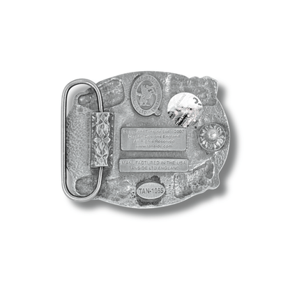 Metallic belt buckle with engraved design on a white background