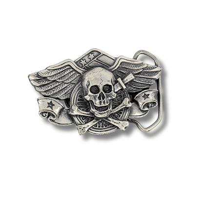 Silver belt buckle with skull and wings design on a white background