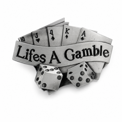 Silver belt buckle with playing cards and dice, featuring 'Life's A Gamble' text on a white background.