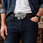 Person wearing a belt with a 'Lifes A Gamble' buckle and dice design.