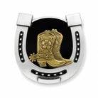 Decorative metal horseshoe belt buckle with gold cowboy boot and black background