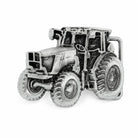 Silver tractor belt buckle on a white background