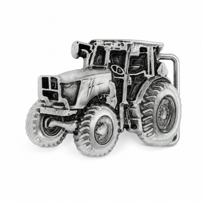 Silver tractor belt buckle on a white background