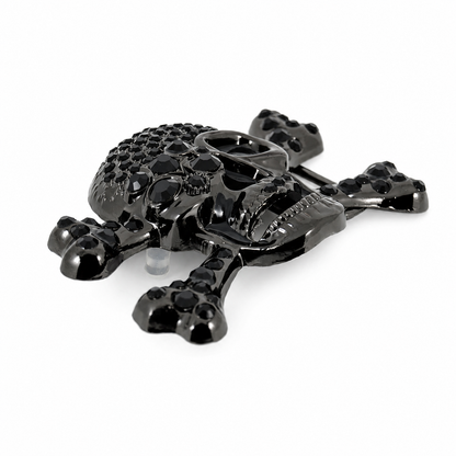 Black skull belt buckle and crossbones design on a white background