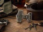 Anchor Belt buckle on a dressing table with belt and accessories.