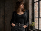 Lady in black wearing anchor belt buckle