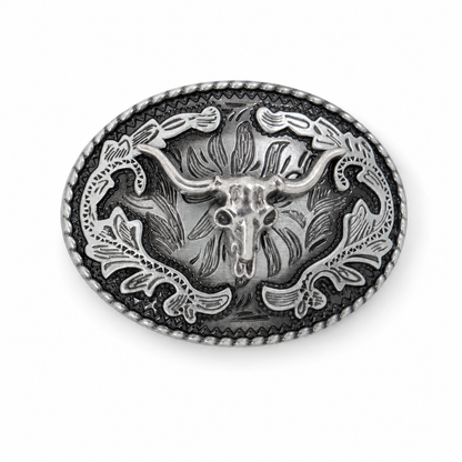 An oval silver-toned metal belt buckle featuring a detailed western design with a central longhorn skull, floral scrollwork, and a textured beaded border, shown on a plain white background.