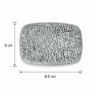A silver textured belt buckle shown with dimension lines indicating a height of 6 cm and a width of 8.5 cm on a white background.