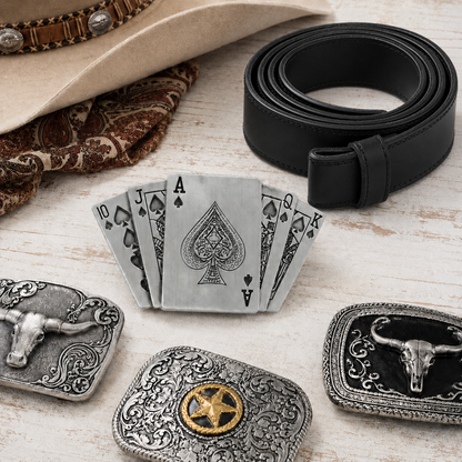 Playing cards belt buckle on a dressing table with belt and accessories.
