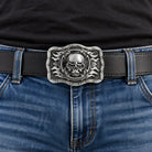 Grey skull and flames belt buckle worn on a black leather belt