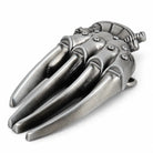 Close-up of razor glove belt buckle showing rivet detailing and claw blades